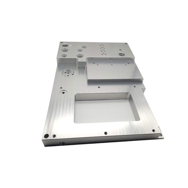 CNC machined aluminum control panel base with multiple cavities and threaded holes.